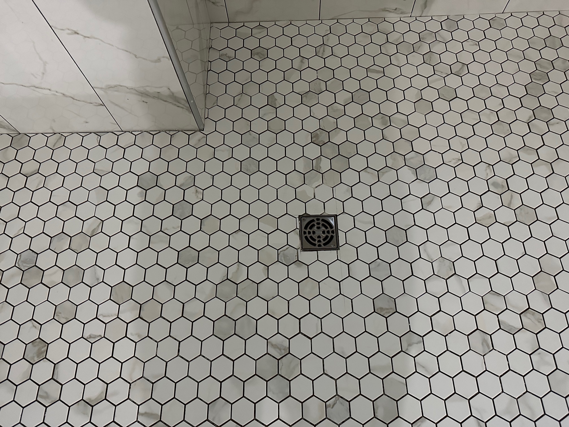 Hexagonal marble mosaic shower floor